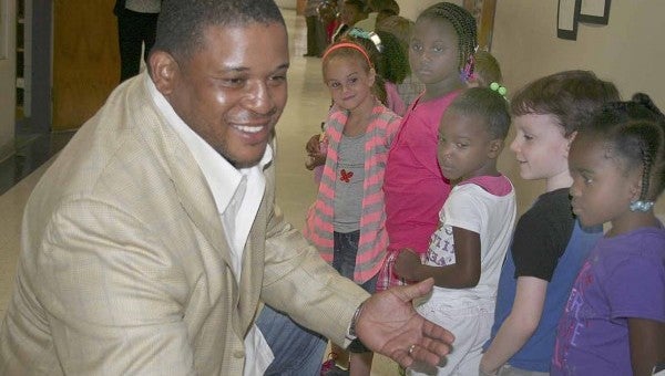 Former NFL start Cornelius Griffin donated school supplies to more than 400 Pike County Elementary School students Monday morning.