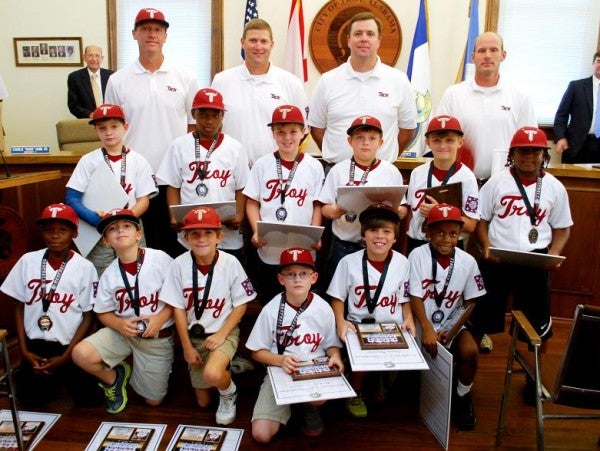 Coaches and team members of the Dixie AA World Series champions from Troy were honored at Tuesday night's city council meeting.