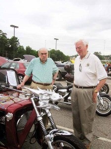 The two oldest members of the Troy Kiwanis Club inspect an unusual entry in the 2012 car show hosted by the club.