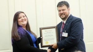 Messenger Photo/Courtney Patterson Laura Cain, one of the P.R.A.I.S.E. scholarship winners, is recognized for the top ACT score at Charles Henderson High School.