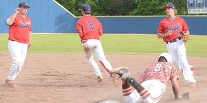 No. 2 Rush Hixon runs through a play to get Monroe baserunner Drew Dees out at first with help from No. 4 Bailey Renfroe and No. 15 Murphy Renfroe. MESSENGER PHOTO/SCOTTIE BROWN