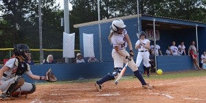 Senior catcher Amberlyn Baker swings her bat low to connect with a pitch from the Glenwood Gators. Baker, along with Kayla Benton, were cele- brated at home Tuesday during senior night as the Pats home season came to a close. Head coach Allie Park said the two girls, along with the whole team, had quickly stolen her heart and she loved every minute of being able to coach the team. MESSENGER PHOTO/SCOTTIE BROWN