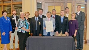 Messenger Photo/Courtney Patterson Pike County declared the week of May 11 to May 15 as Business Development Week. Officials from across the county joined the Pike County Chamber of Commerce Wednesday to sign the proclamation.