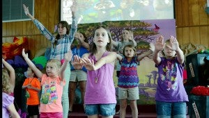 Messenger Photo/Courtney Patterson Vacation Bible Schoolers at Good Hope Baptist Church dance along to the theme song at the opening ceremony of Wednesday’s VBS session.