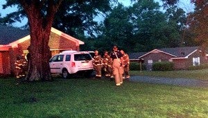 MESSENGER PHOTO/SCOTTIE BROWN Lightning struck a tree in the 100 block of Mobley Drive at approximately 7:45 p.m. Firefighters reported that the family was sitting in their vehicle at the time of the incident and both the Honda Pilot and pickup truck were struck. No injuries were reported during the incident. 