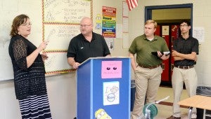 MESSENGER PHOTO/COURTNEY PATTERSON Engineers from Sikorsky are mentoring the robotics students. From left, Alissa Jordan, robotics teacher; Charles Allen, Sikorsky; Travis Doss, Sikorsky, and Christopher Brent, Sikorsky.