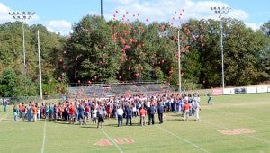MESSENGER PHOTO/COURTNEY PATTERSON Students at Pike Liberal Arts School released red balloons to kick off Red Ribbon Week for the city of Troy. 