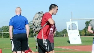 MESSENGER PHOTO/COURTNEY PATTERSON Troy University students participated in the second annual Troy for Troops Ruck-a-Thon Wednesday. Students carried a 20-pound ruck sack on their backs while they ran laps around the university track.