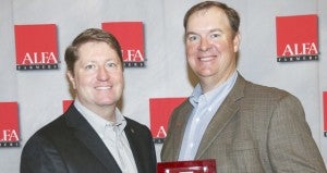 Alabama Farmers Federation Executive Director Paul Pinyan, left, presented the Federation Award for Excellence to Pike County President Steve Stroud during the Federation’s 94th annual meeting in Montgomery on December 7. Stroud was elected to the Federation Board of Directors as District 10 director.
