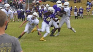 Photo/mike hensley Zach Alford runs the ball for the Purple team in Goshen’s Purple Gold Spring Game on Wednesday afternoon. Alford ran for about 60 yards in the game, but the Gold Team held on to win 10-6. 