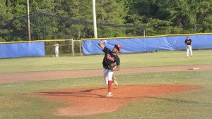 Messenger Photo/mike hensley Javon Christian pitches for the Reds on Thursday evening. Christian threw a complete game shutout in the Reds 13-0 win.