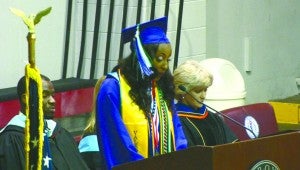 messenger PHOTO/Jacob Holmes Valedictorian Chelsey Holland gives her address to the Pike County High School graduating class on Thursday night.