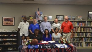 Messenger Photo/mike hensley Pike Liberal Arts senior Regine Parker signed a scholarship on Tuesday to play basketball at Faulkner University.