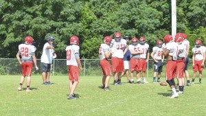 Photo/mike hensley Pike assistant coach Robert Rollan talks to his players during practice on Wednesday afternoon. The Patriots will begin the 2016 season this Friday night when the take on the Clarke Prep Gators. 