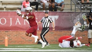 Troy wide receiver Hiram Velez (7) catches a touchdown pass past Austin Peay linebacker Elijah Shepard (6) during the first half of NCAA college football game in Troy, Ala., Saturday, Sept. 3, 2016. (Photo/Thomas Graning)