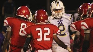 submitted Photo Brock Snyder shakes hands with Luvene earlier this season. Snyder and the Eagles return home this Friday night to take on Houston Acadmey.