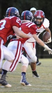 Photo/submitted Reece Burbage runs the ball for the Patriots on Friday night. Burbage and the Patriots remained undefeated after defeating the Eagles 41-15.