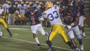 Photo/jonah enfinger Jabronski Williams runs the ball for the Charles Henderson Trojans on Friday night. Williams and the Trojans got by the Eagles 21-12 on Friday night on homecoming.