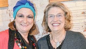 Female Facotr on Wednesday focused on ghost stories. Dottie Black (left) told fortunes of the ladies who attended. Harriet Outlaw (right), author of "Haunted Baldwin County Alabama," told ghost stories from south Alabama. Inset: The cat lady asked not to be identified.