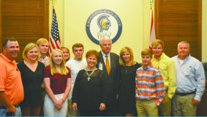 Johnny Witherington and his family pose for a picture during the Troy City Council meeting on Tuesday. During the meeting Witherington was honored for his 32 years of service to the Troy City Council.