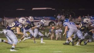 Photo/jonah enfinger Eagles quarterback Brock Snyder hands the ball off to running back Zack Alford. The Eagles will welcome in Central Hayneville on Friday night for homecoming 