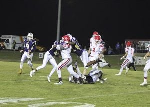 submitted Photo/April brown #8 Azavion Rogers and #17 Iyan Hinkle of the Goshen Eagles with the tackle during Goshen’s 48-7 win over Zion Chapel on Friday night.