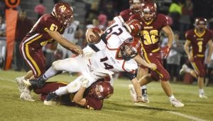 submittedPhoto/daniel evans Pike qurterback Reed Johnson reaches for yardage while getting tackles in Pike’s 13-6 win over Morgan on Friday night.